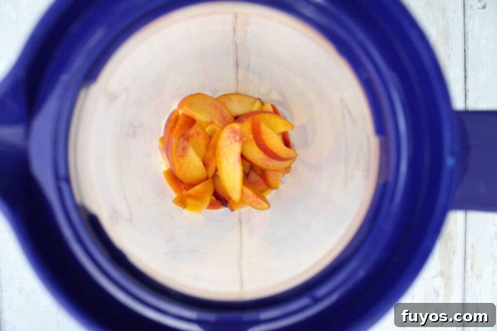 add washed and sliced peaches to pitcher