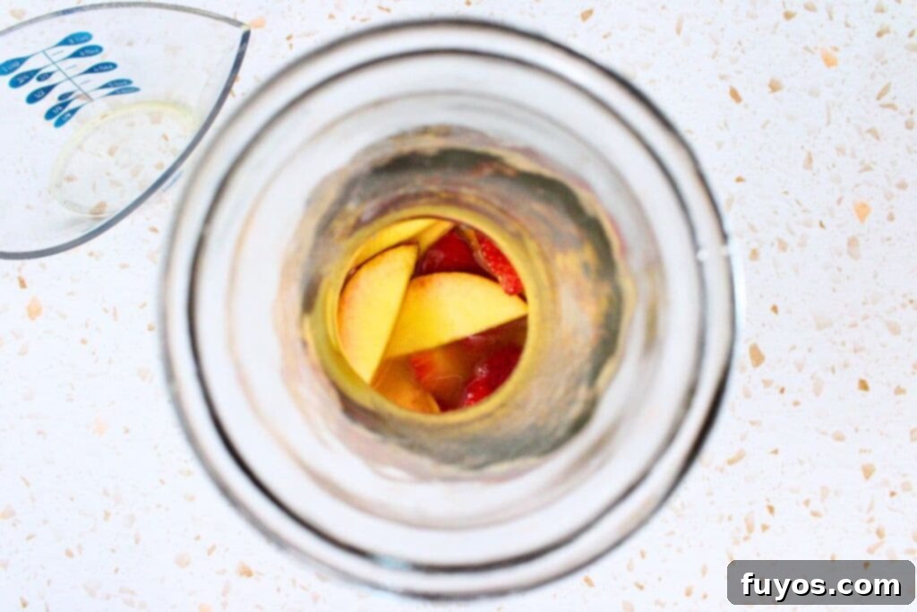 add whisky, lemonade, and peach nectar to pitcher