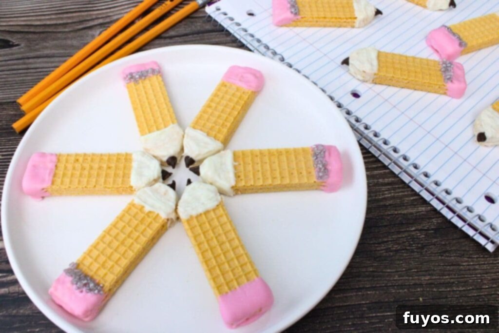 Pencil Wafer Cookies Perfect for Back to School Fun 11 pencil wafer cookies pinwheeling out on a plate next to a notebook with more cookies on top