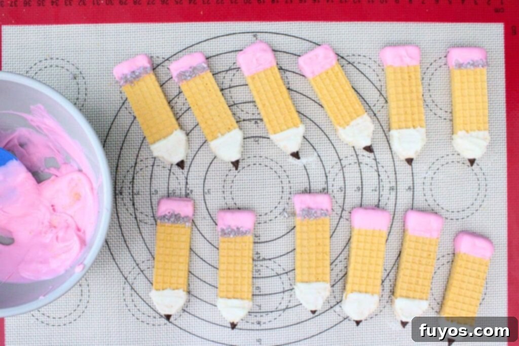 Pencil Wafer Cookies Perfect for Back to School Fun 9 dip the uncut side of the wafer in the pink chocolate
