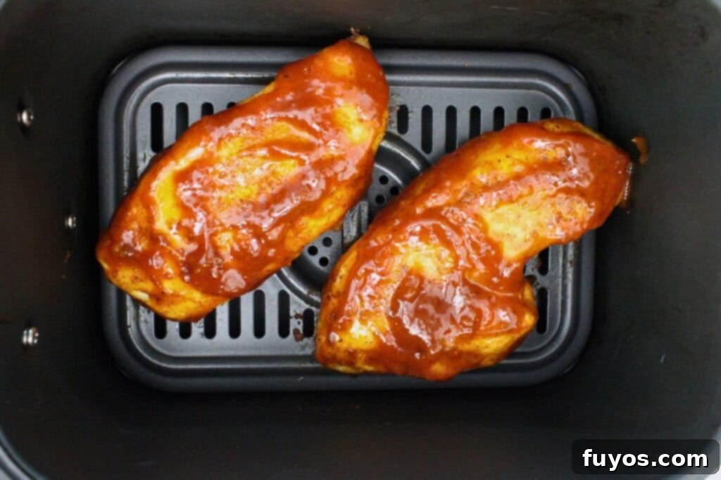 Simple Air Fryer Peach Whiskey BBQ Chicken Recipe 8 Baste the air-fried chicken with a generous layer of peach whiskey BBQ sauce and continue cooking to glaze.