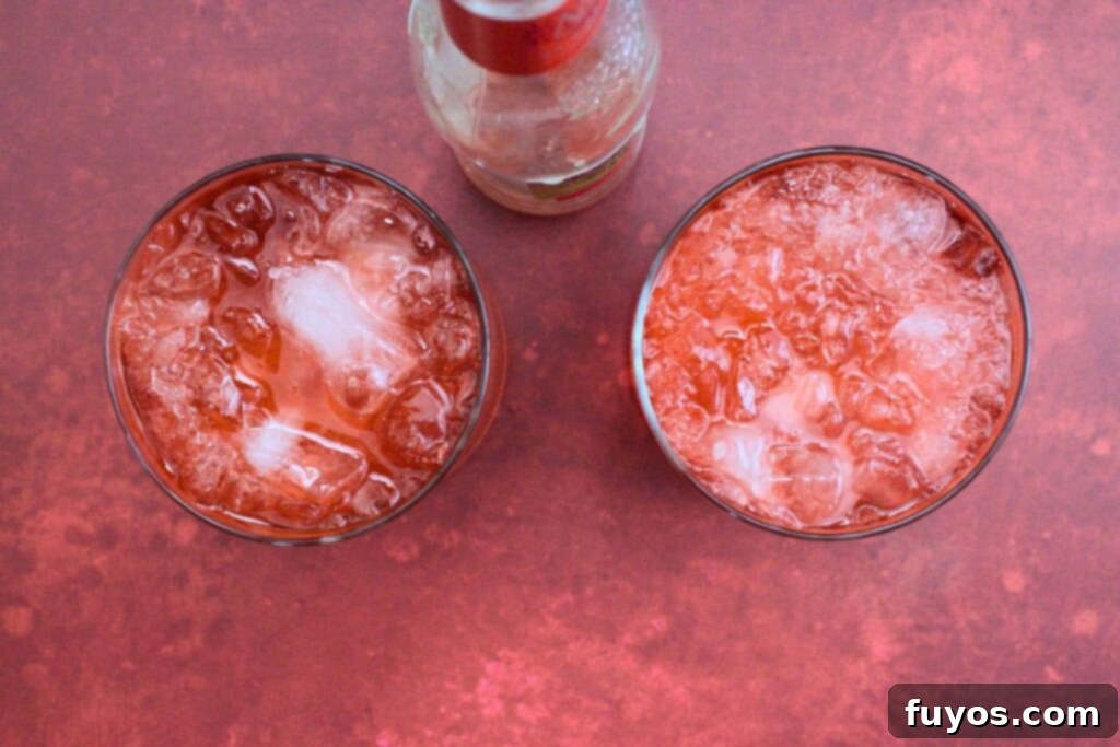 Blood Moon Rum Potion Zesty Halloween Brew 7 topping blood moon cocktail with blood orange ginger beer for a bubbly finish