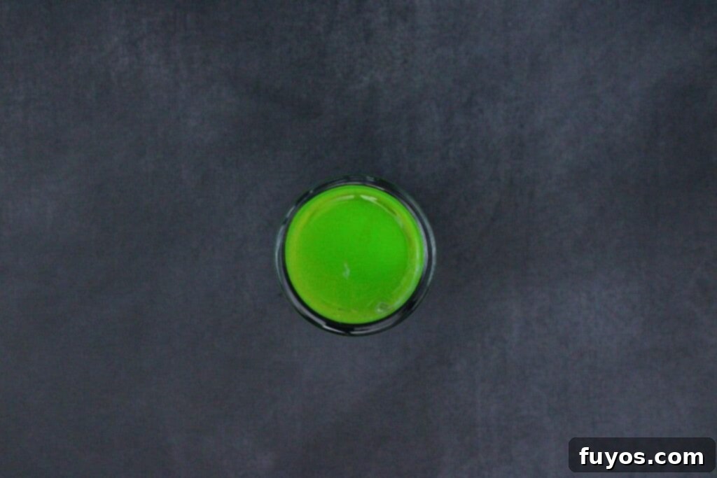 Beetlejuice Shot Layered Halloween Party Drink 7 finally add a top layer of midori melon liqueur