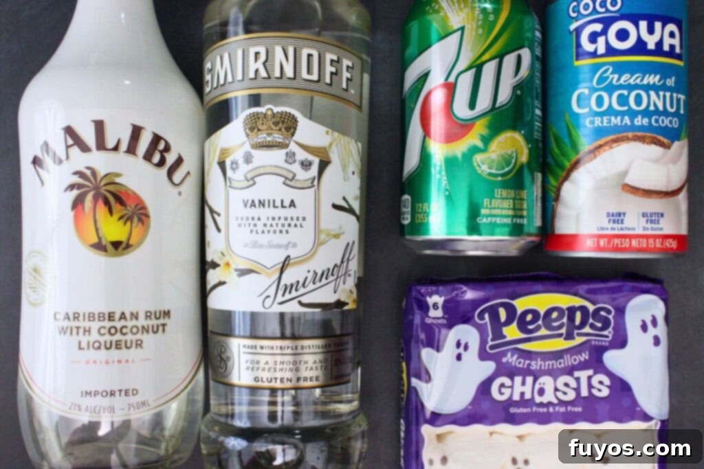 All the ingredients neatly laid out on a table to make a Drunk Ghost Cocktail, including bottles of coconut rum and vanilla vodka, a can of lemon-lime soda, and a jar of coconut cream.