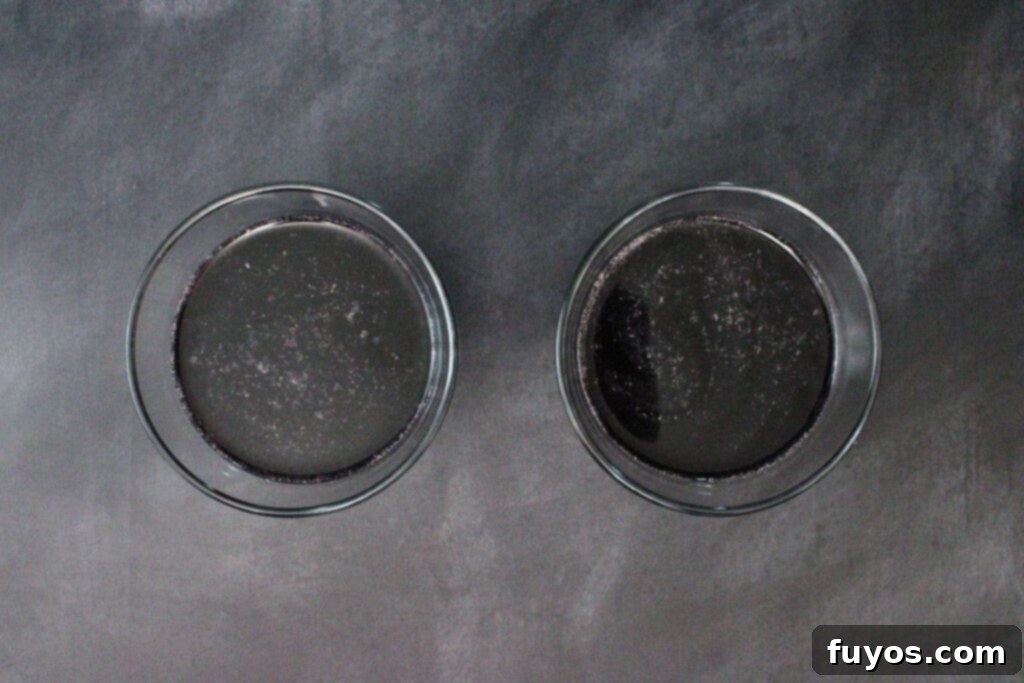 Black Magic Martini: Halloween's Darkest Spell 6 shake and strain black martini into glasses