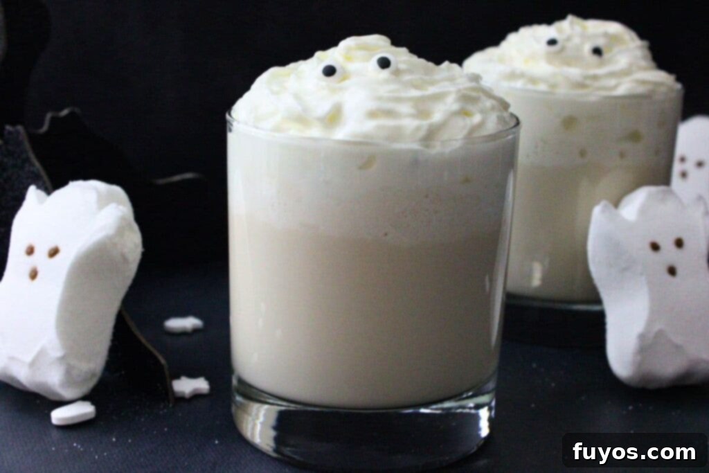 Screaming Ghost Cocktail The Perfect Halloween Potion 3 two screaming ghost cocktails next to ghostly marshmallow peeps