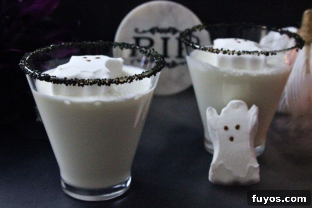 Halloween Spirits A Ghostly Vodka Martini 3 two ghost martini cocktails with black sugar rim