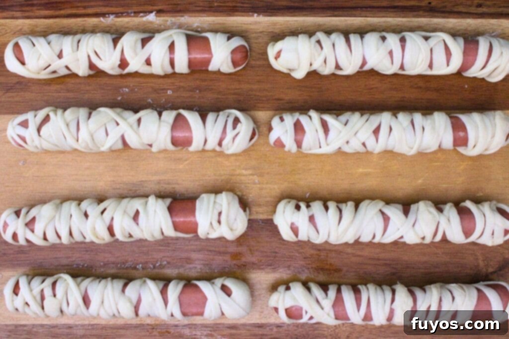 Air Fryer Mummy Dogs Your Easy Halloween Fun 6 wrap each hot dog in 3 to 4 strips of crescent dough