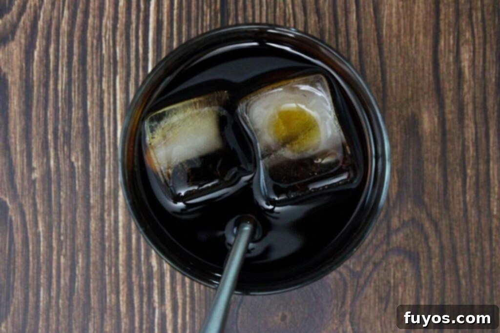 add all black manhattan ingredients to a glass with ice and stir