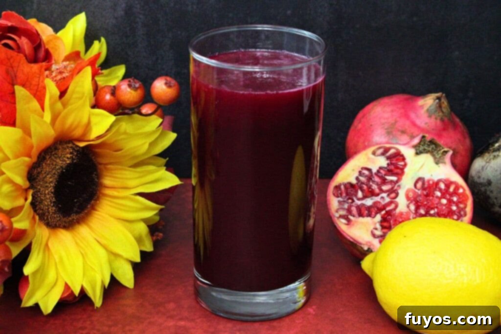 Easy Three Ingredient Beetroot Pomegranate Lemonade 9 beetroot pomegranate lemonade surrounded by fresh fruit and flowers