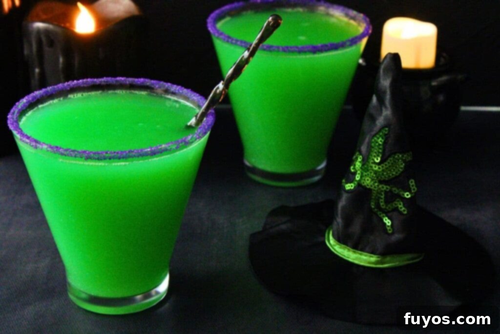 Wicked Witch Vodka Cocktail 10 Two Broadway-inspired Wicked Witch Cocktails in martini glasses, next to a small witch hat prop