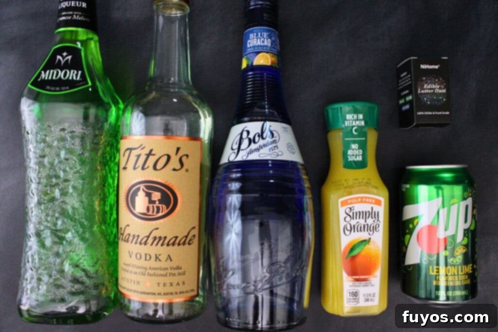 Wicked Witch Vodka Cocktail 4 Ingredients laid out for making the Wicked Witch Cocktail: vodka, Midori, blue curacao, orange juice, Sprite, and luster dust