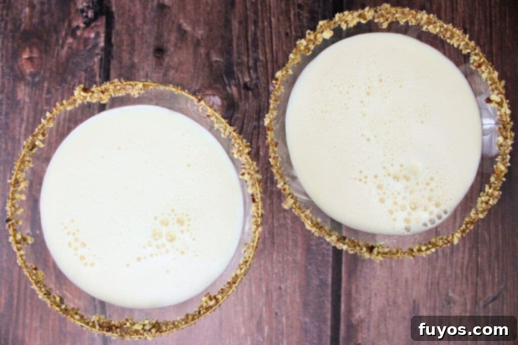 shake pecan pie martini until chilled and strain into prepared glasses