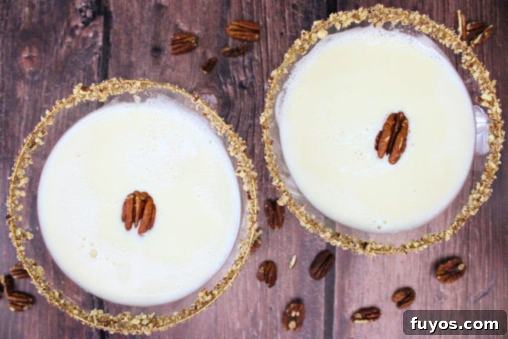 overhead view of two pecan pie martinis garnished with pecan half