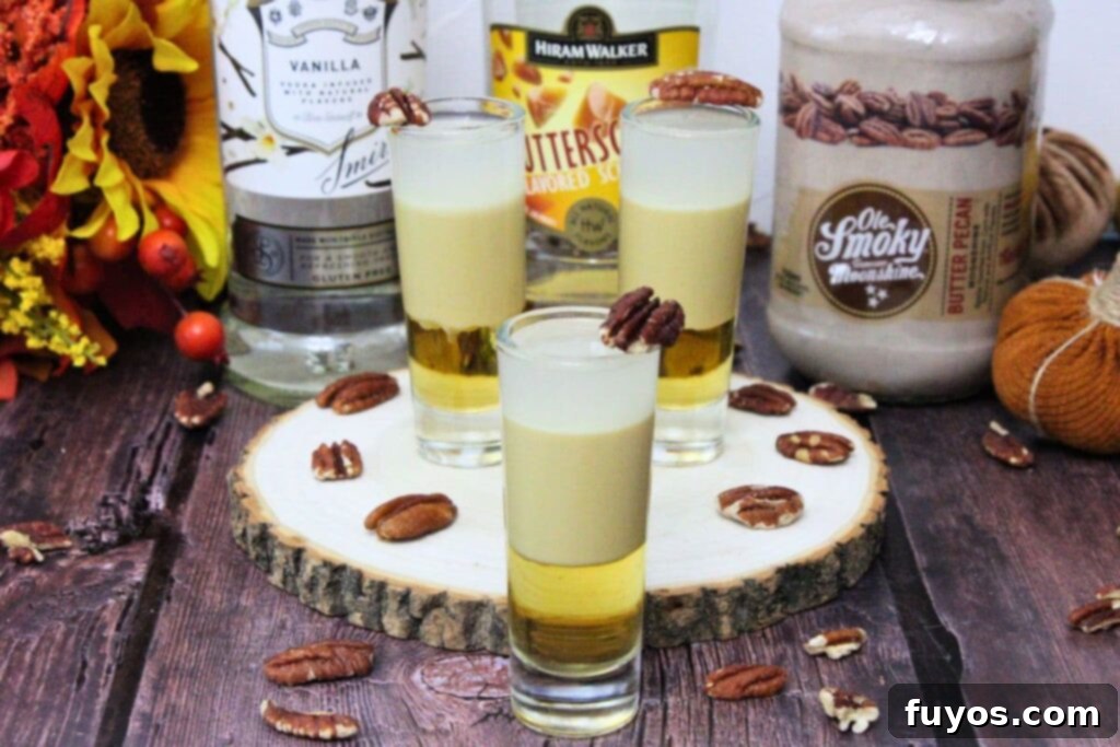 pecan pie shots on a rustic stump with liquor bottles behind