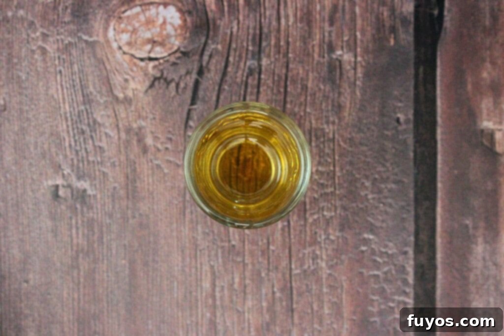 pour butterscotch schnapps in shot glass