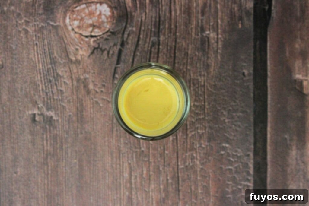 slowly layer butter pecan liqueur over schnapps