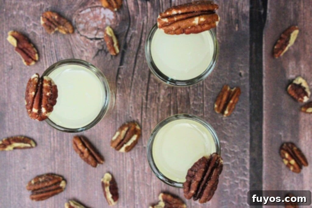 overhead view of three pecan pie shots with fresh pecans