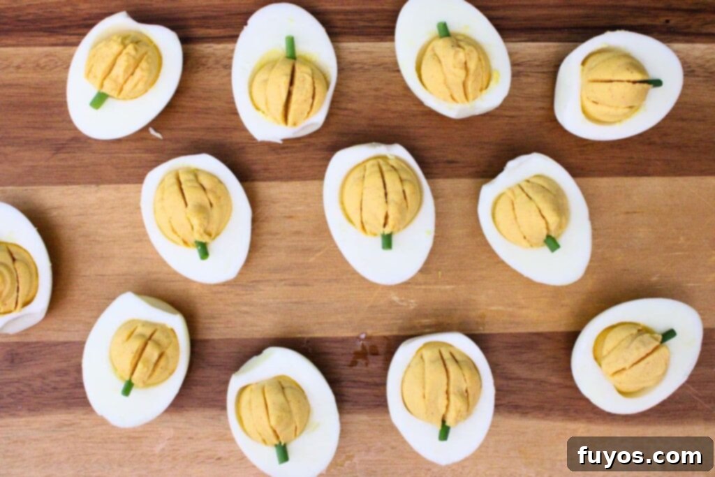garnish deviled eggs with a piece of chive for a stem