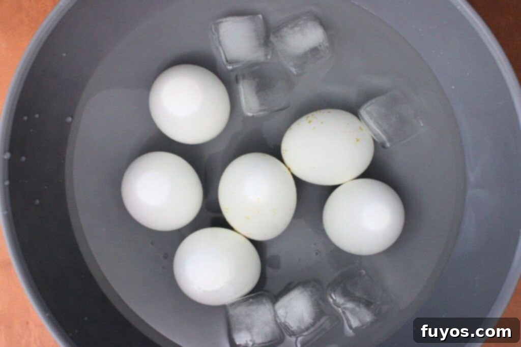 transfer eggs to ice bath until cool enough to handle