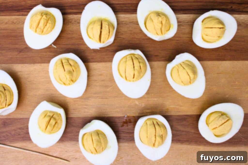 use a toothpick to add vertical lines to egg filling