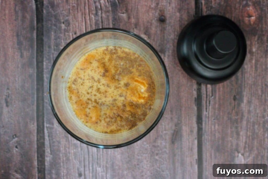 add pumpkin pie martini ingredients to cocktail shaker