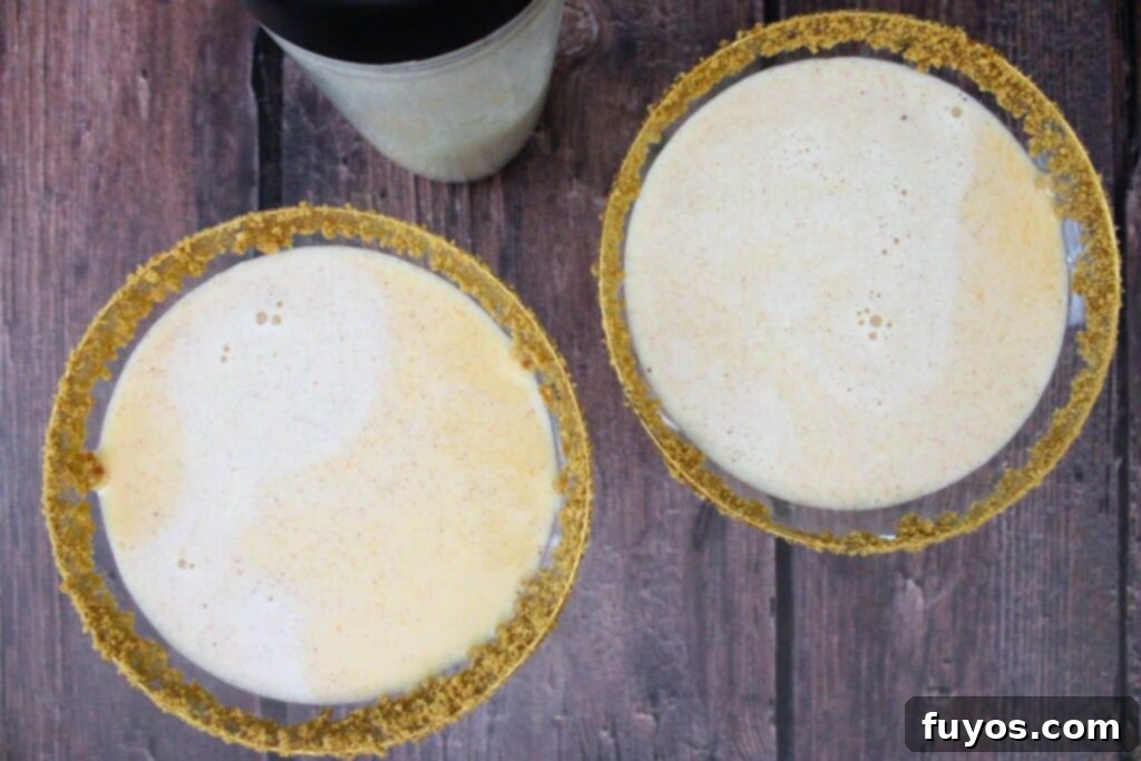 shake pumpkin pie martini until chilled and strain into prepared glasses