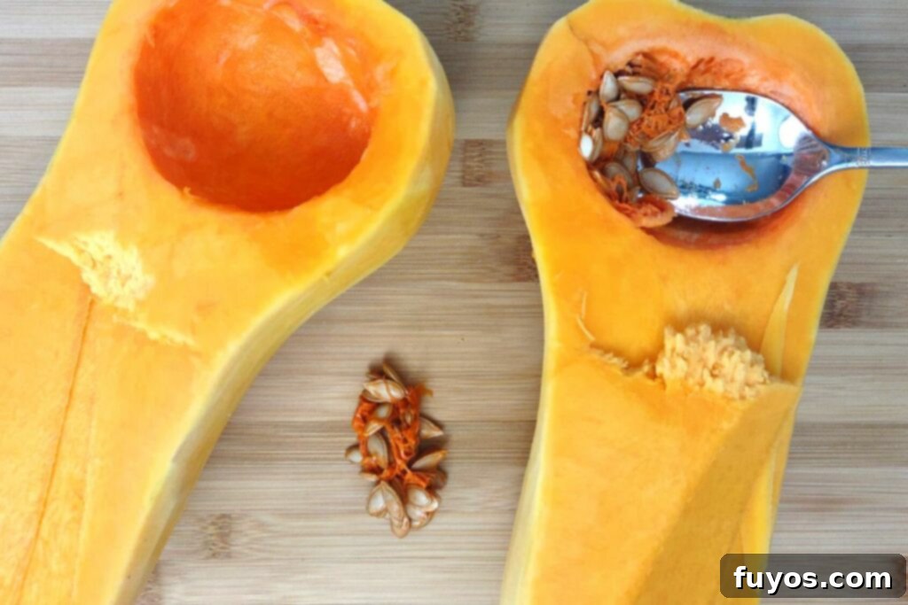 Step 3: Scoop out the seeds and stringy pulp from the butternut squash halves.