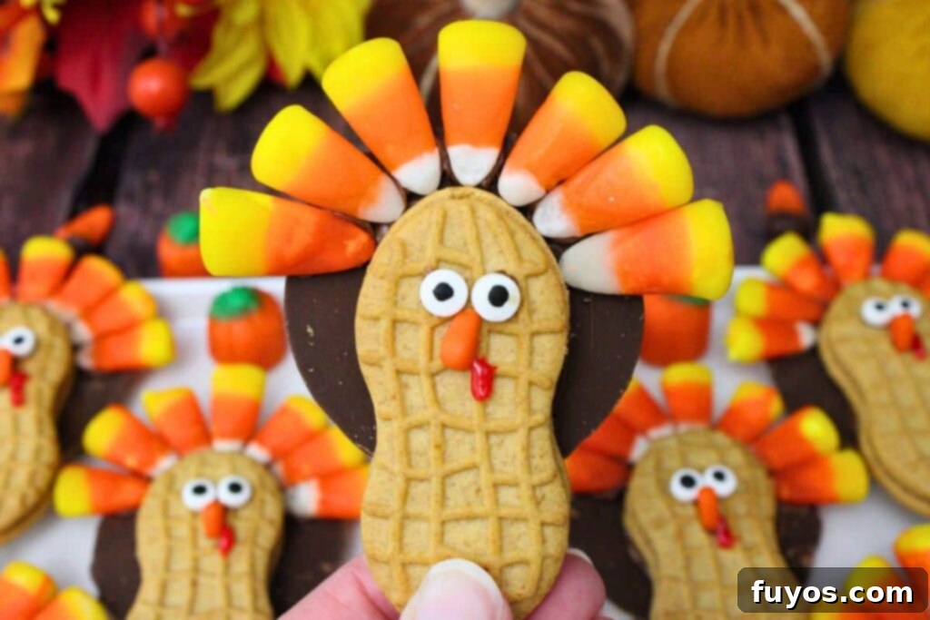 holding up a nutter butter turkey cookie close to the camera