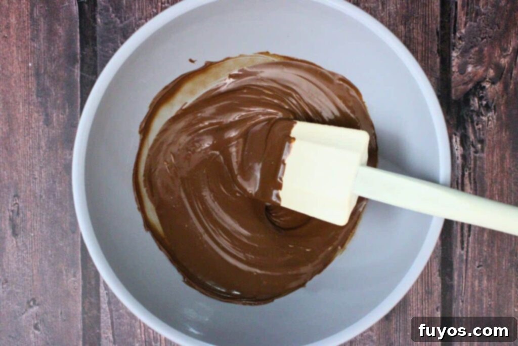 add milk chocolate chips to microwave safe bowl and heat until melted