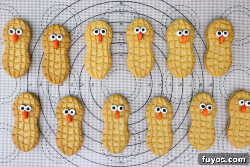 add eyes and beak to nutter butter cookies
