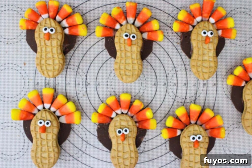 press candy corn tips into the fudge stripe cookie
