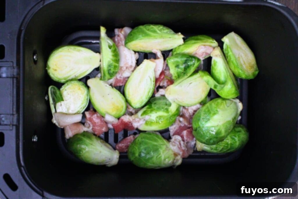 add bacon and brussel sprout mixture to air fryer basket