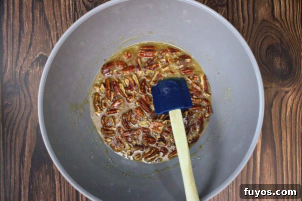 combine brown sugar, butter, corn syrup, vanilla, egg, and chopped pecans in a microwave safe bowl