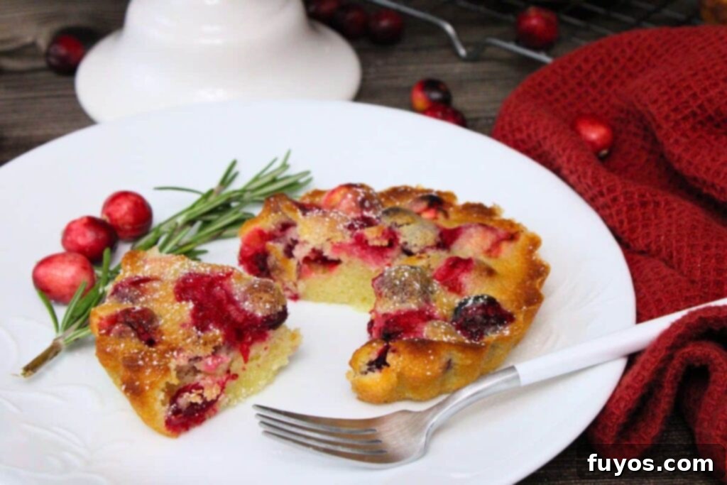 Air Fryer Holiday Mini Cranberry Pies No Crust 3 cutting a small slice out of an air fryer mini crustless cranberry pie