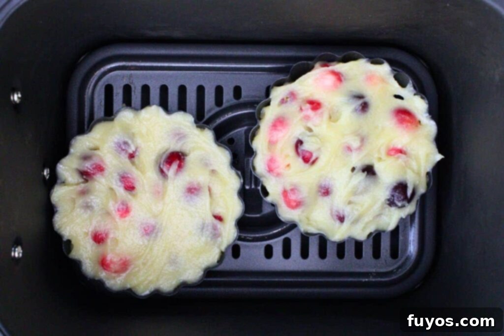 Air Fryer Holiday Mini Cranberry Pies No Crust 9 place mini filled cranberry pie tart pans in air fryer basket