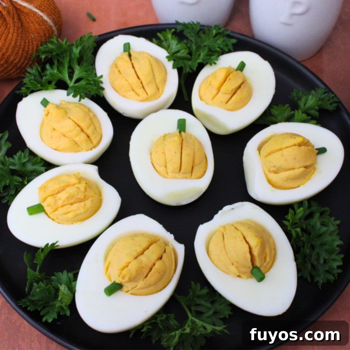 Crispy & Quick: 19 Air Fryer Thanksgiving Recipes for a Perfect Feast 3 Delightful pumpkin deviled eggs made in the air fryer, perfect for Thanksgiving appetizers.