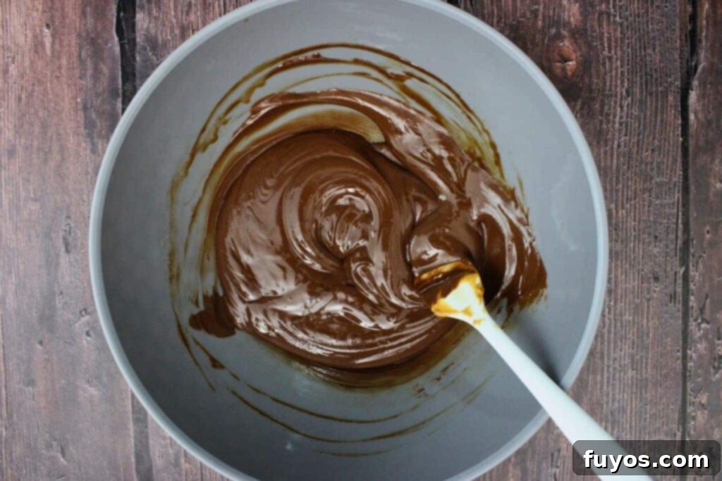 Easy No Bake Christmas Puppy Chow 7 cook and stir chocolate and peanut butter mixture
