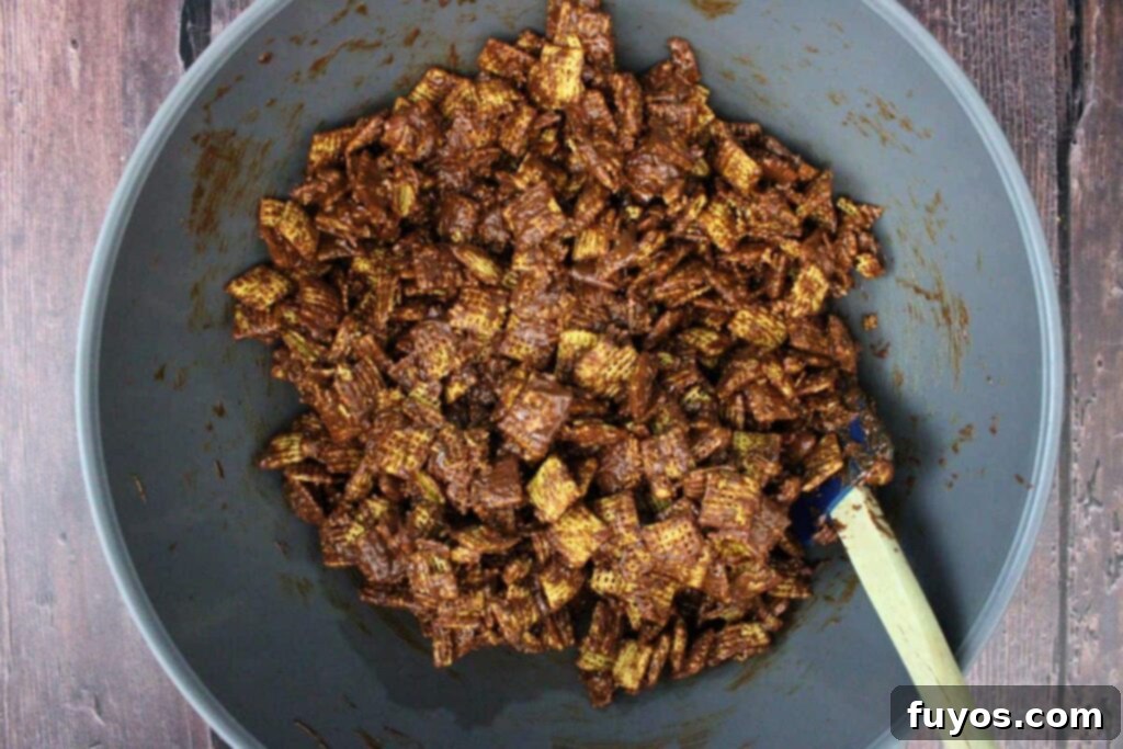 Easy No Bake Christmas Puppy Chow 8 add peanut butter chocolate mixture to chex cereal