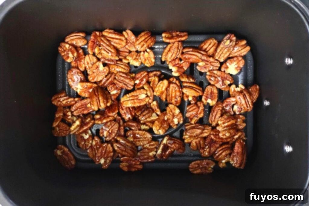 add raw pecans coated in honey to preheated air fryer basket