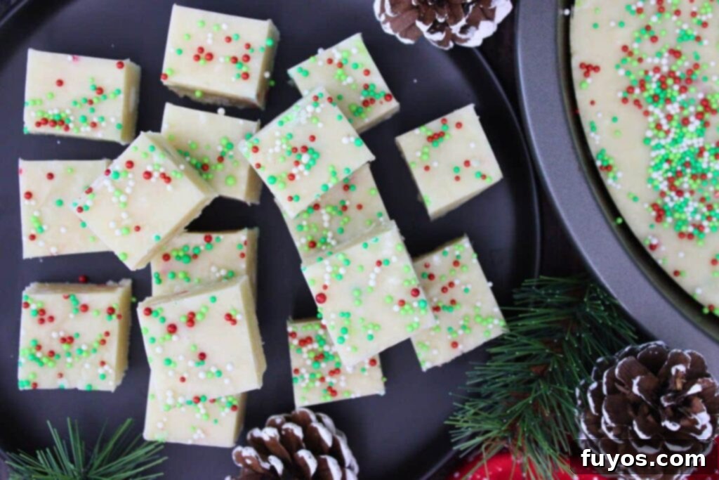Easy Microwave Christmas Sugar Cookie Fudge Treat 9 Overhead view of perfectly cut sugar cookie fudge squares on a serving plate