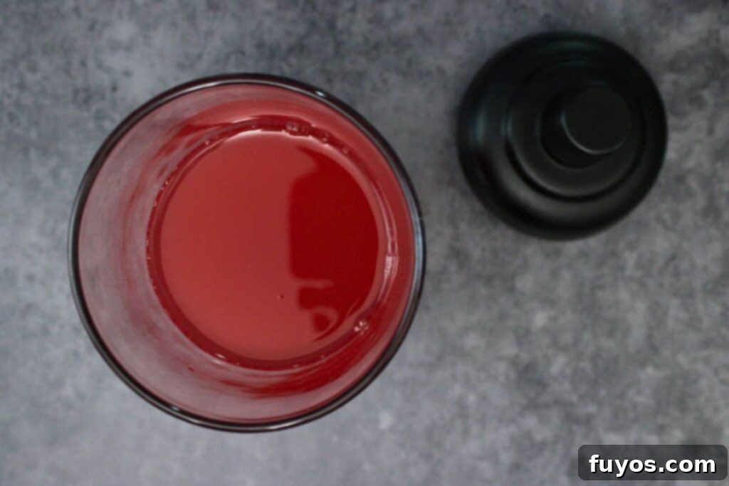 Applebee's Tipsy Reindeer: Your Homemade Holiday Cocktail 6 Step 2: Add vodka, cranberry juice, grenadine, and sour mix to a cocktail shaker