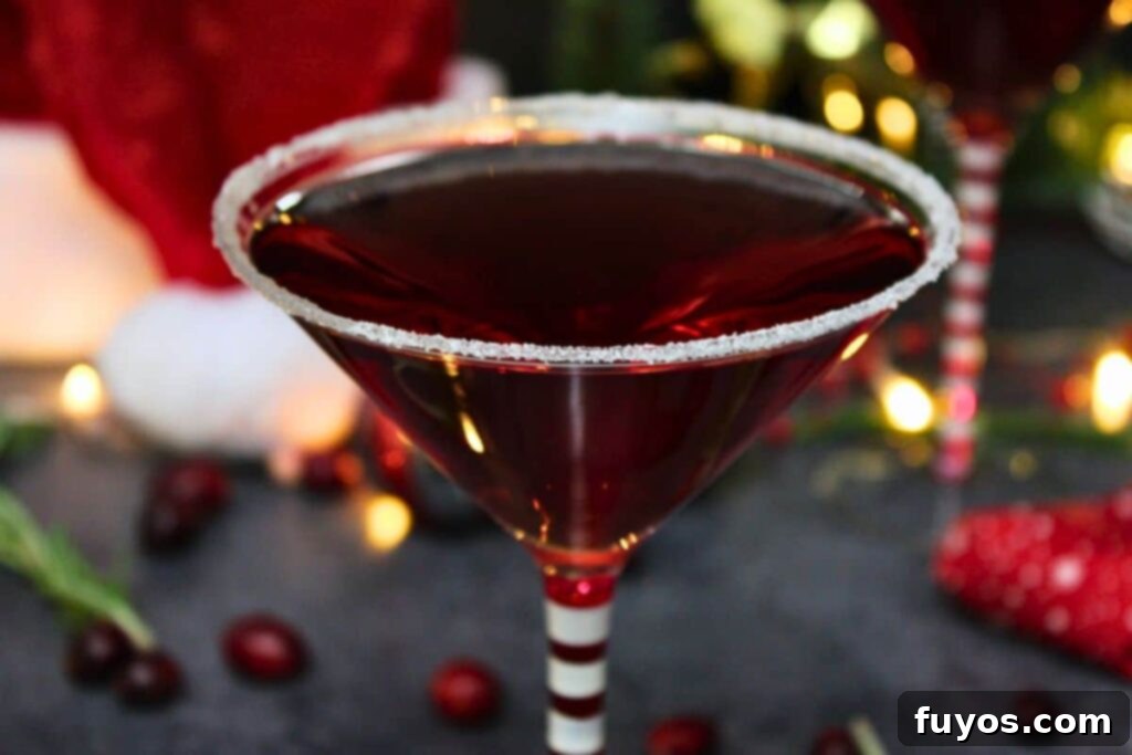 Santa Clausmopolitan Your Ultimate Holiday Drink 3 closeup view of santa clausmopolitan with sugar rim