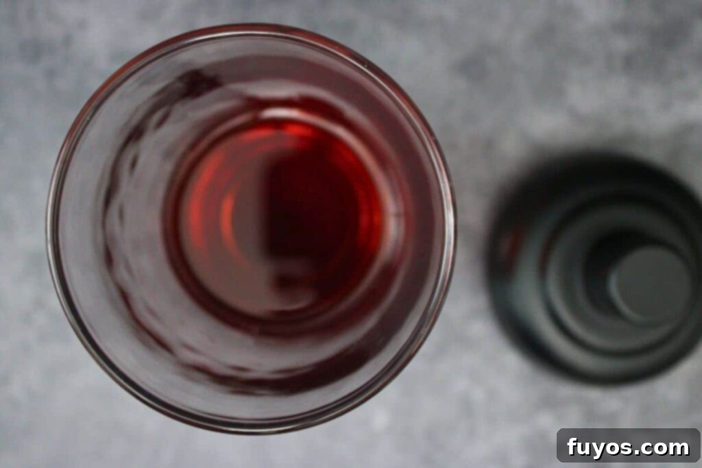 Santa Clausmopolitan Your Ultimate Holiday Drink 6 add vodka, triple sec, and cranberry juice to cocktail shaker