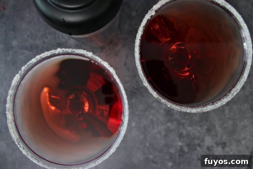 Santa Clausmopolitan Your Ultimate Holiday Drink 7 shake and strain santa clausmopolitan into prepared glasses