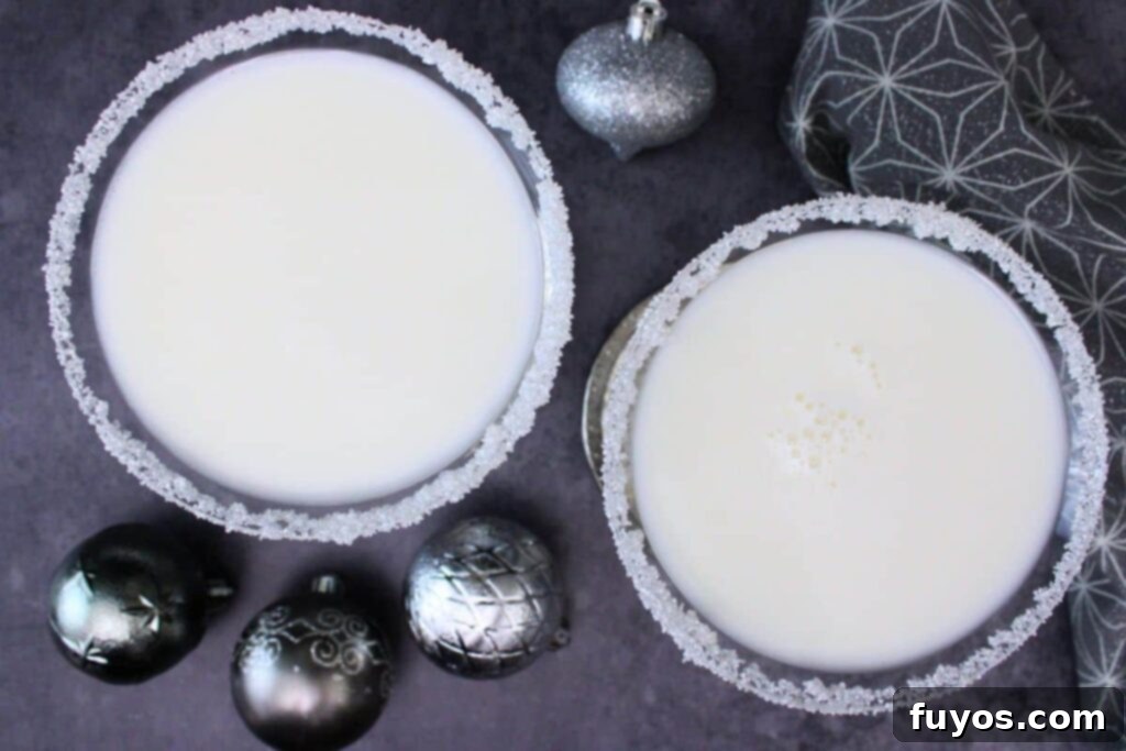 White Christmas Martini An Easy Holiday Cocktail With Vodka 8 overhead view of two white christmas martinis and silver ornaments