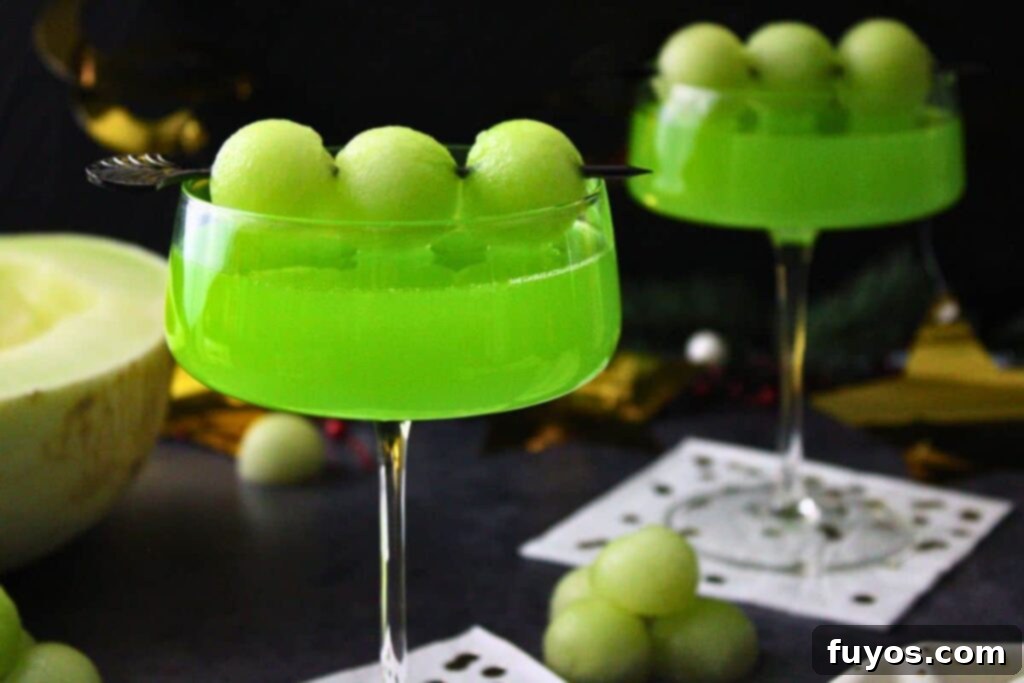 two melon ball drop cocktails on gold confetti napkins