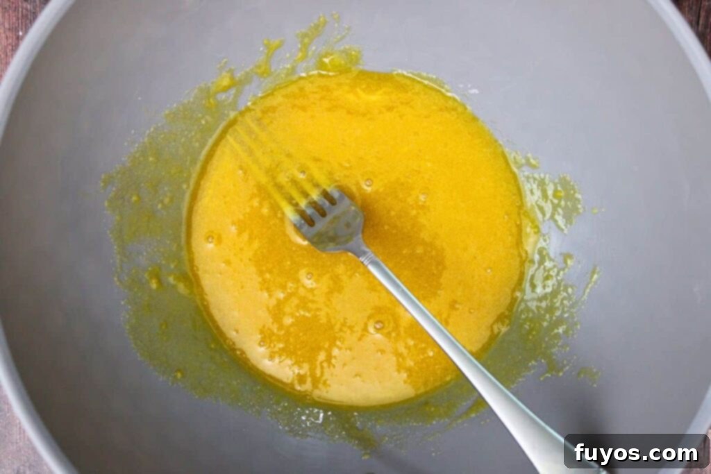 combine egg yolks, sugar, and vanilla in a mixing bowl