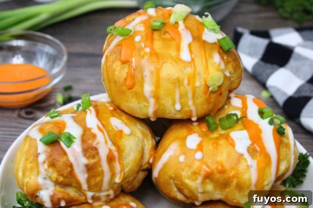 Game Day Air Fryer Buffalo Chicken Bombs 11 full air fryer buffalo chicken bombs stacked on a plate