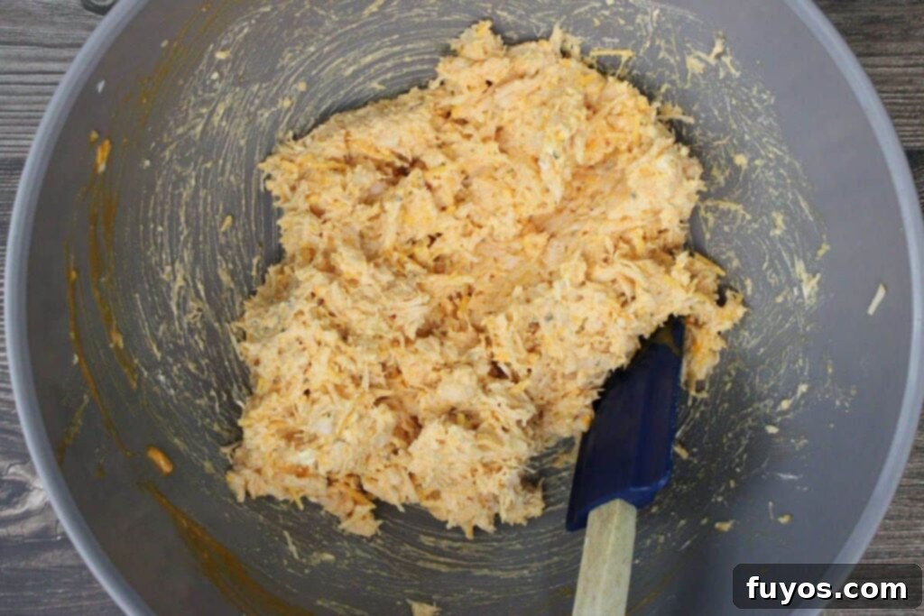 Game Day Air Fryer Buffalo Chicken Bombs 5 combine chicken, buffalo sauce, ranch, garlic powder, cream cheese, and cheddar cheese